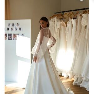 White Wedding Dress with Elegant Design and Flowing Silhouette